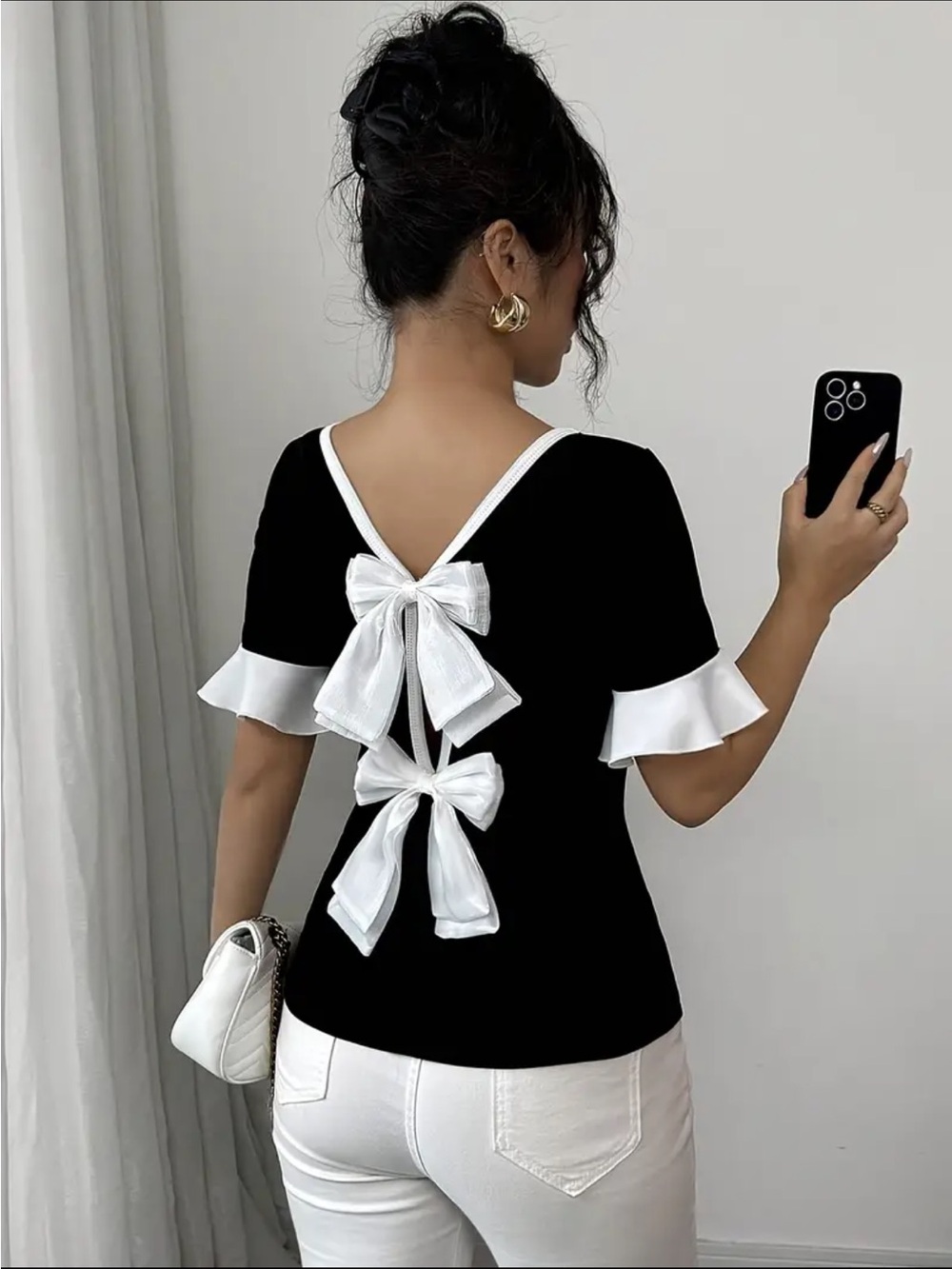 Elegant Black Bow-Back Top with White Trim